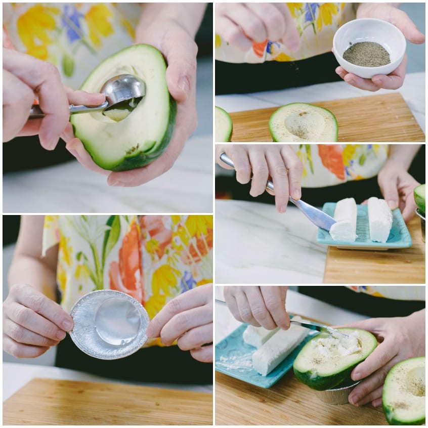 Mani che scavano l'avocado, aggiungono pepe e farciscono con formaggio caprino