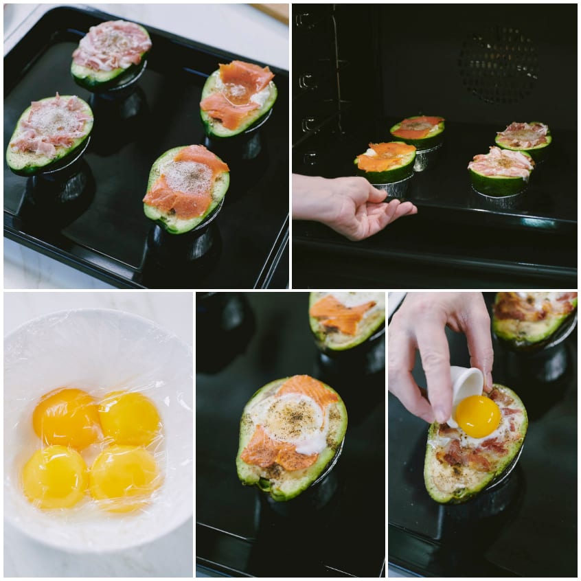Mezze avocado farcite con salmone e prosciutto pronte per il forno, poi i tuorli adagiati sugli albumi cotti