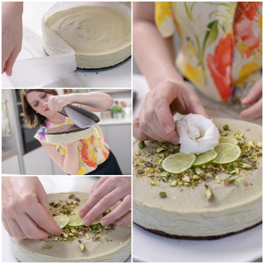 Mani che decorano la cheesecake di avocado con fette di lime, pistacchi tritati e panna montata
