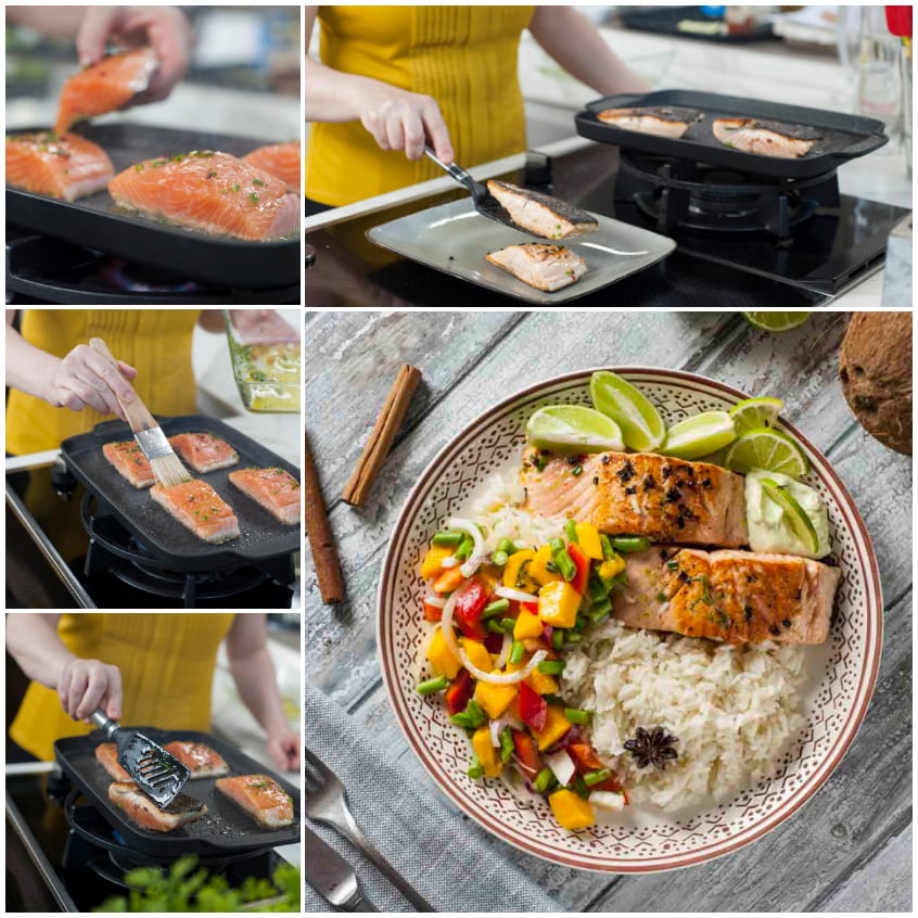 Tranci di salmone grigliati serviti con riso e insalata di mango e peperoni colorati