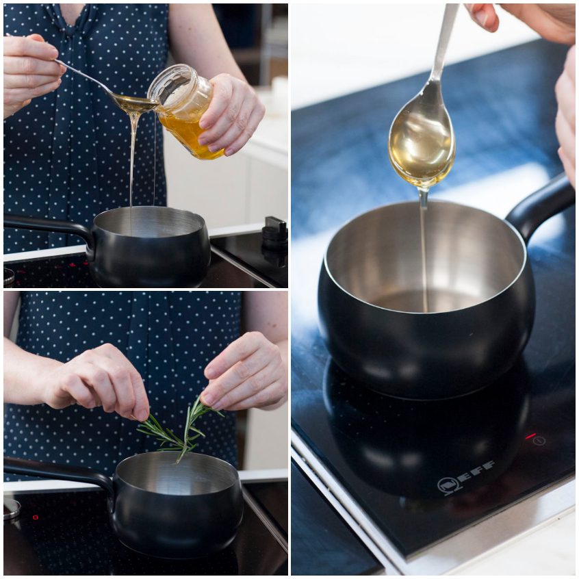 Miele versato in un pentolino e rametto di rosmarino aggiunto per aromatizzare