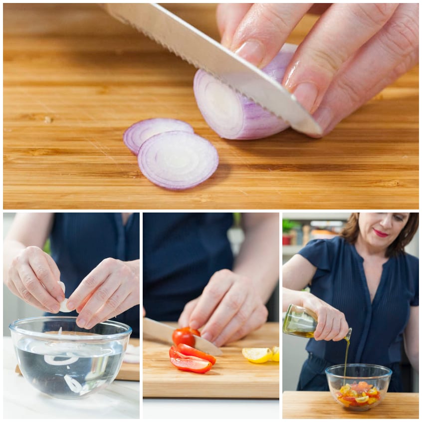 Pomodorini tagliati a spicchi sul tagliere, poi messi in ammollo con la cipolla e conditi con olio