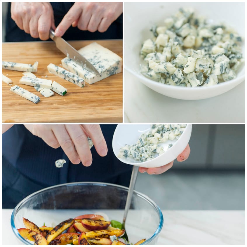 Gorgonzola tagliato a tocchetti e sbriciolato sulle pesche grigliate nell'insalata