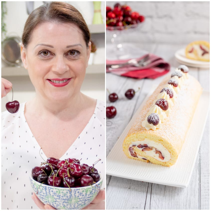 Rotolo alle ciliegie finito, decorato con ciuffi di panna montata, ciliegie fresche e zucchero a velo