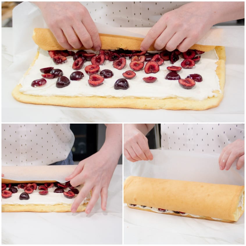 Mani che arrotolano il pan di Spagna farcito con panna e ciliegie usando la carta forno