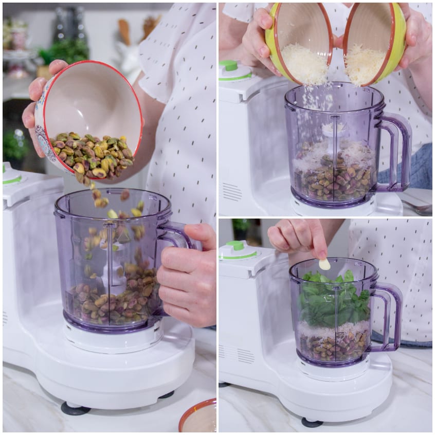 Pistacchi, formaggio grattugiato, basilico e aglio aggiunti nel frullatore per il pesto di pistacchi