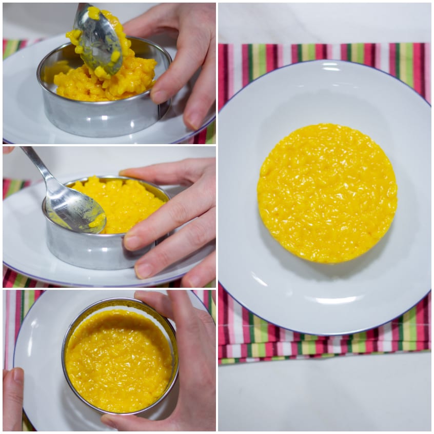 Risotto allo zafferano compattato in un coppapasta e sformato sul piatto di servizio