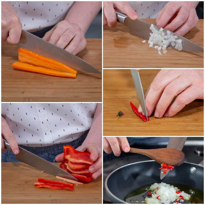 Carote, cipolla, peperone e peperoncino tagliati sul tagliere, poi soffritto in padella con olio
