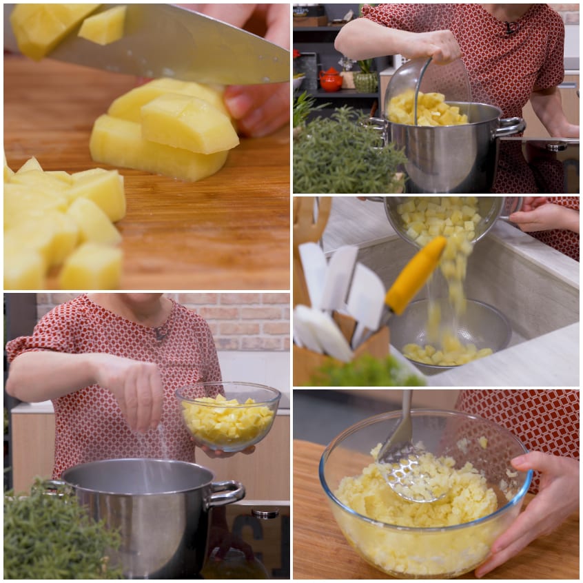 Patate tagliate a cubetti, lessate, scolate e schiacciate in una ciotola