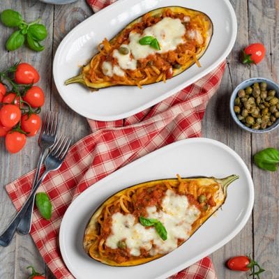 Melanzane ripiene di linguine al pomodoro, fior di latte fuso, capperi e basilico fresco