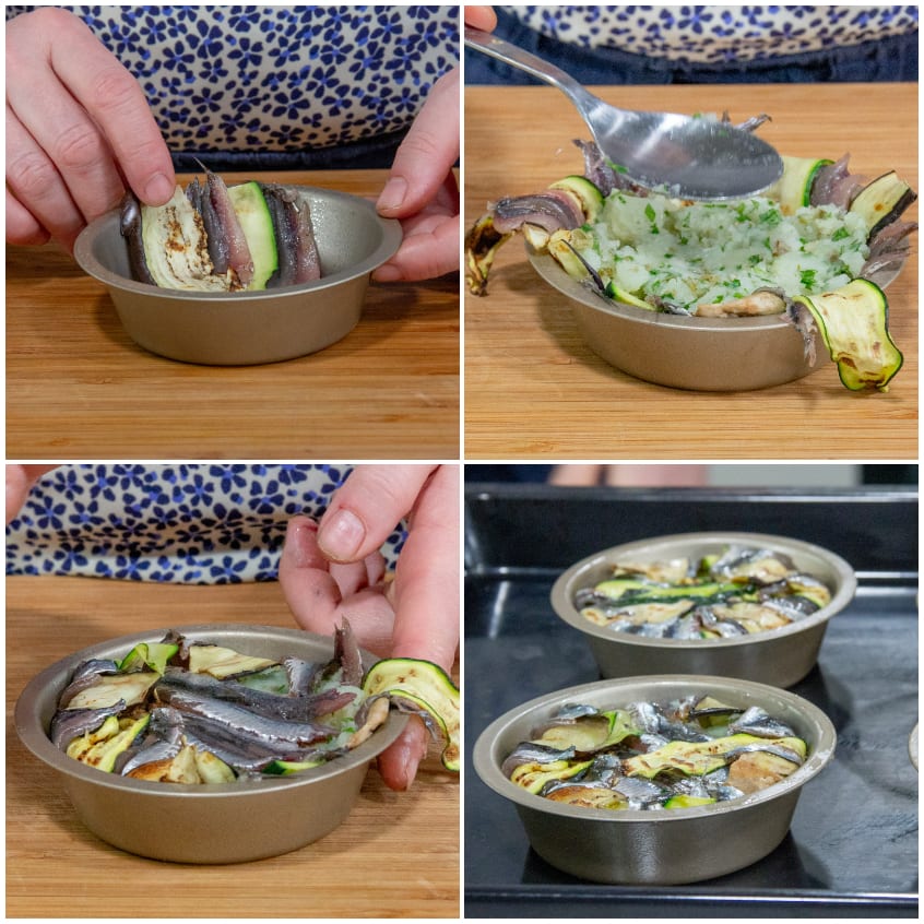 Alici e zucchine grigliate disposte a strati negli stampini, poi riempite con purè alle erbe e chiuse prima della cottura