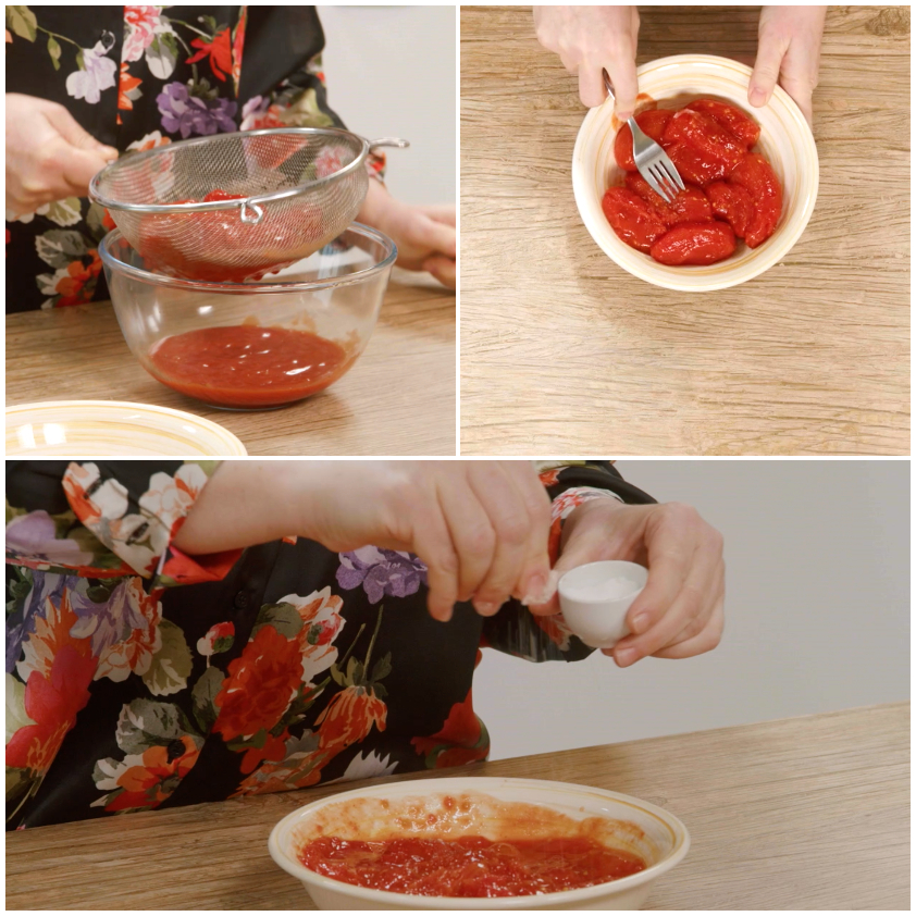 Pomodori pelati scolati, schiacciati con una forchetta e conditi con olio e sale