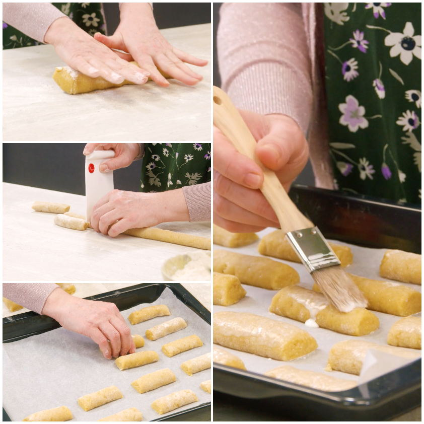 Filoncini di impasto modellati a mano, disposti sulla teglia e spennellati con latte
