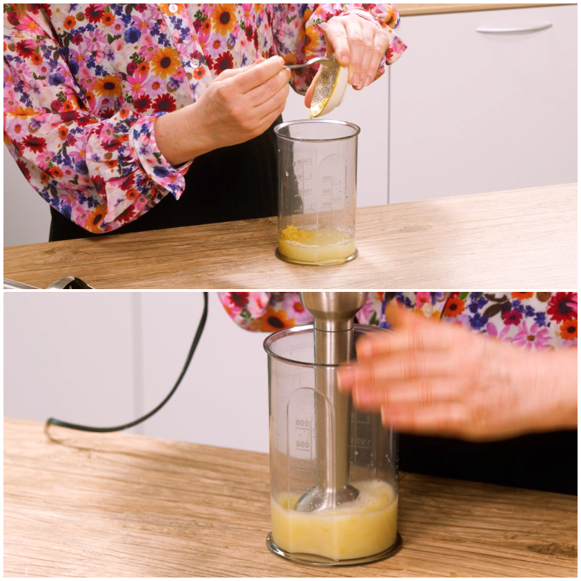 Succo di limone frullato con un mixer a immersione nel bricchetto graduato