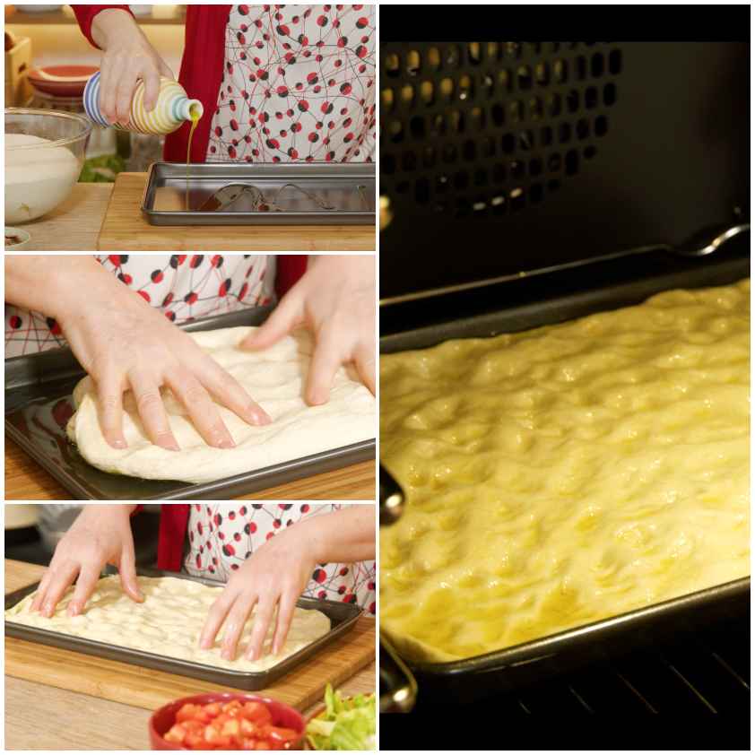 Mani che stendono l'impasto della focaccia messinese nella teglia unta d'olio, pronta per la seconda lievitazione