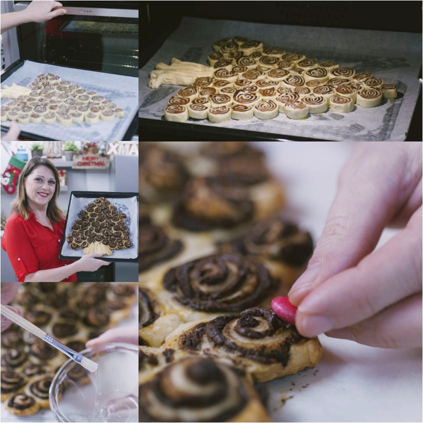 Mano che applica confettini colorati sulle girelle di sfoglia al cioccolato a forma di alberello