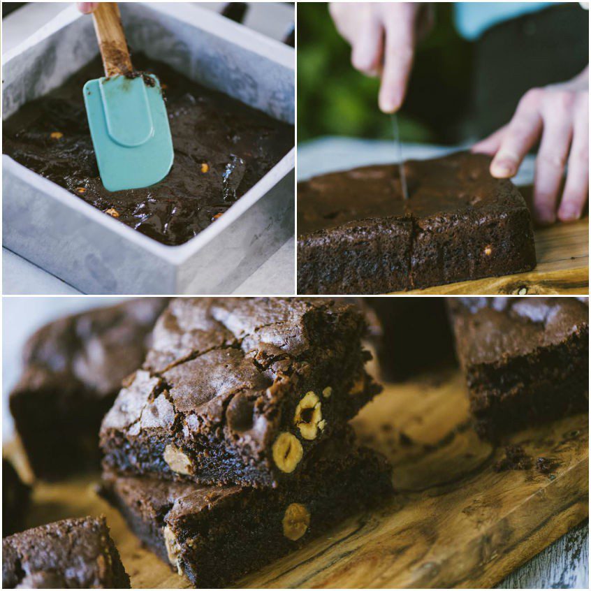 Brownies al cioccolato con nocciole tagliati a quadrati su tagliere di legno
