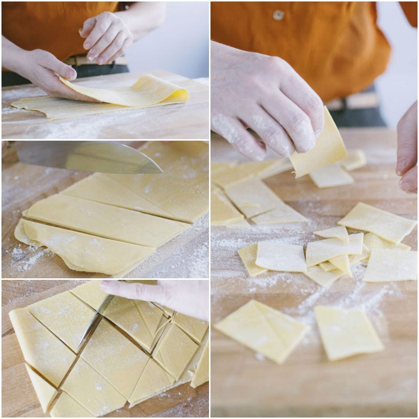 Sfoglia di pasta fresca tagliata a losanghe irregolari sul piano infarinato
