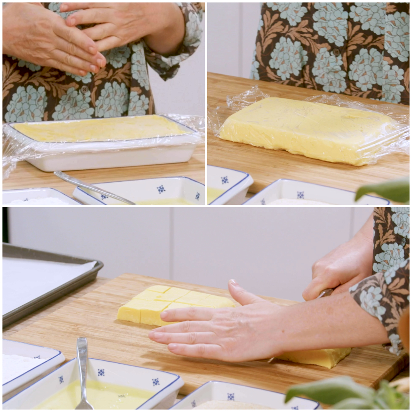 Blocco di crema pasticcera sformata e tagliata a cubotti sul tagliere
