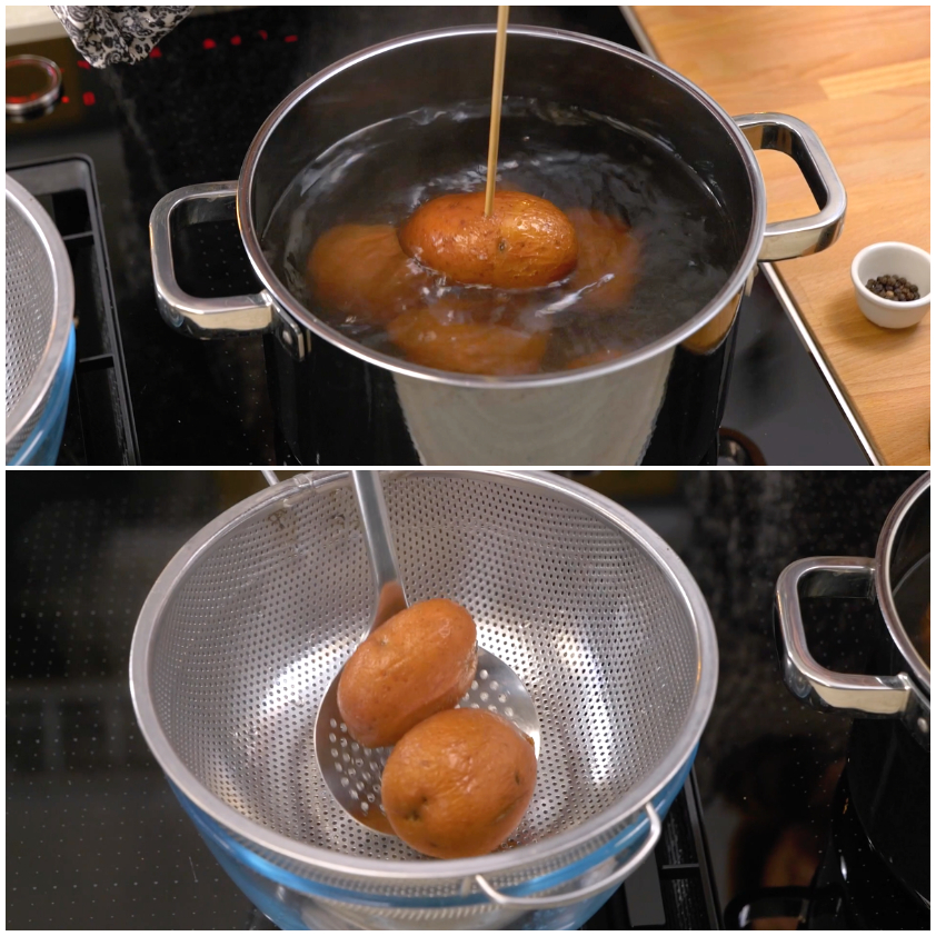Patate lessate scolate nello scolapasta ancora fumanti e leggermente tiepide
