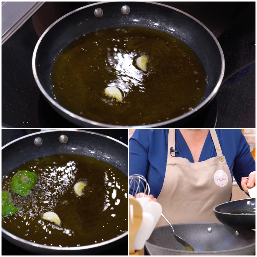 Aglio e basilico che soffriggono nell'olio caldo in padella