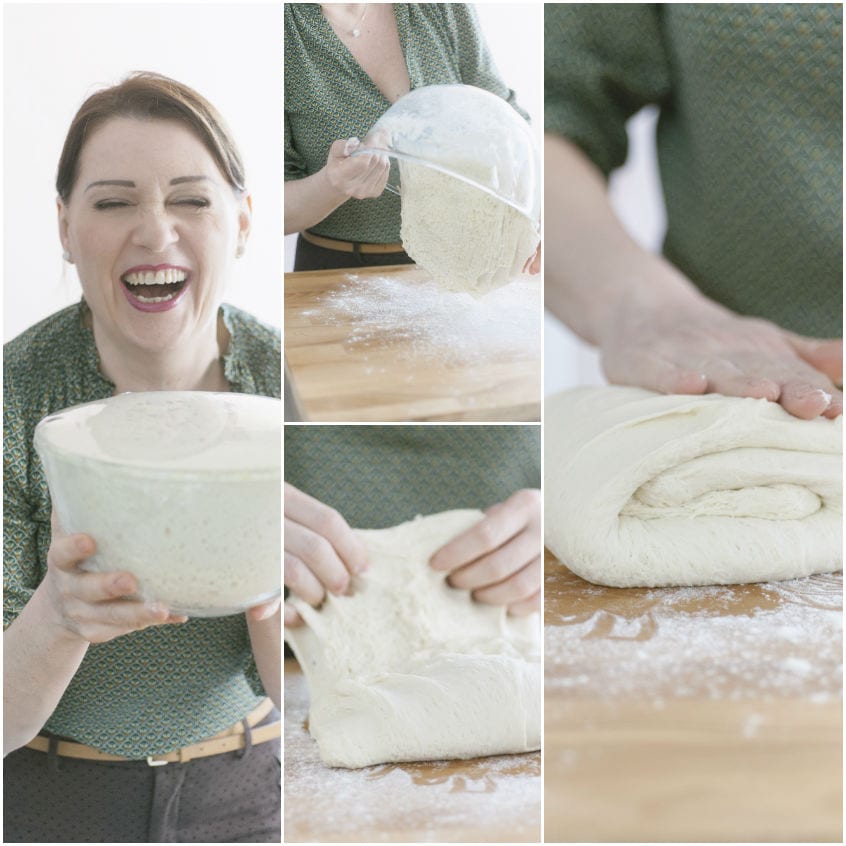 Impasto lievitato del casatiello ripiegato su piano infarinato durante le pieghe di rinforzo