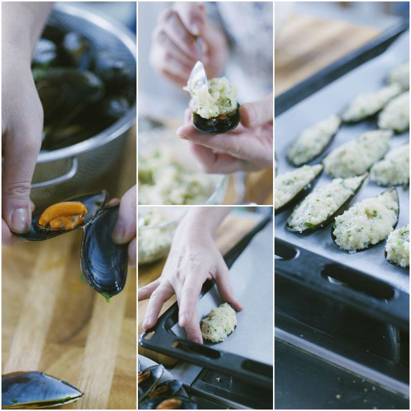 Cozze aperte farcite con impasto di pane e disposte su una leccarda pronte per la gratinatura