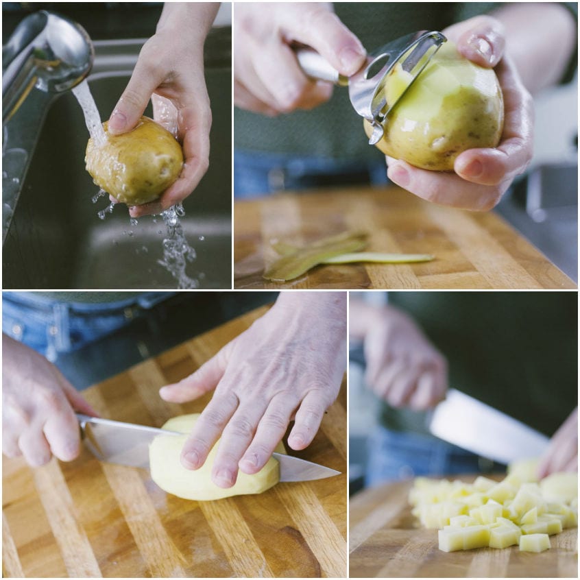 Patate lavate, sbucciate con il pelapatate e tagliate a cubetti sul tagliere