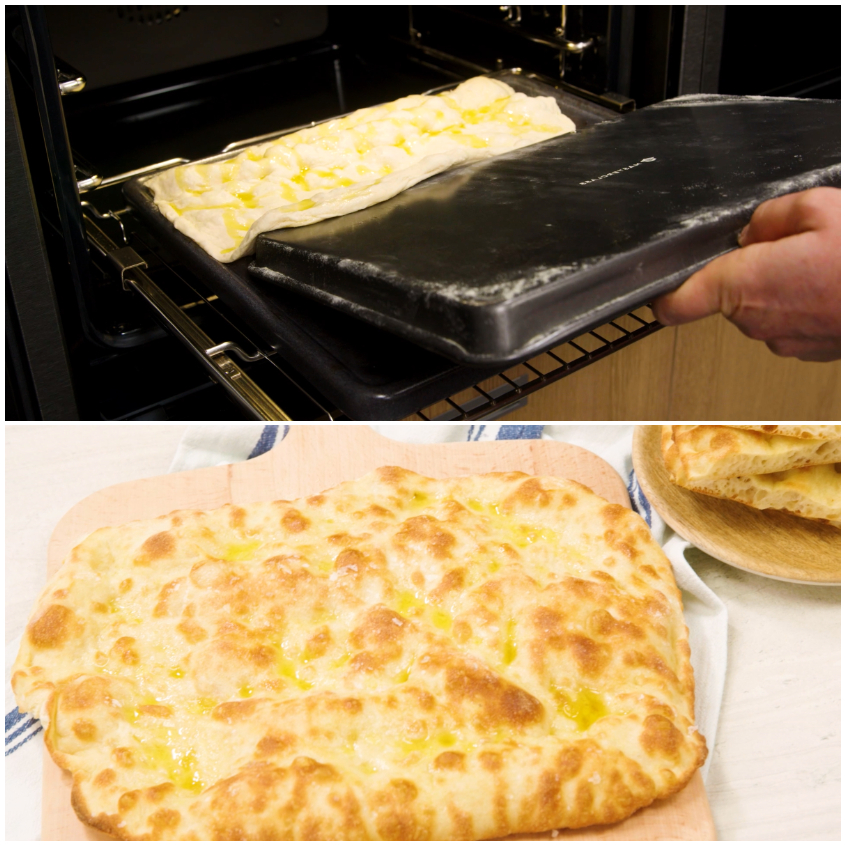 Pizza bianca romana appena sfornata con superficie dorata e croccante su tagliere