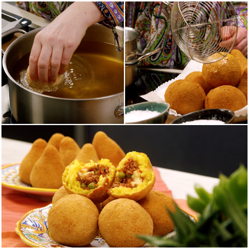 Arancini fritti immersi nell'olio bollente, poi scolati e serviti con il ripieno di ragù e piselli in vista