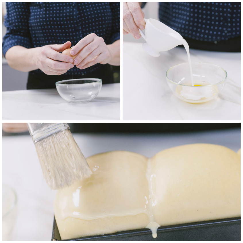 Pennello che spennella la superficie del pan brioche lievitato con miscela di uovo e panna