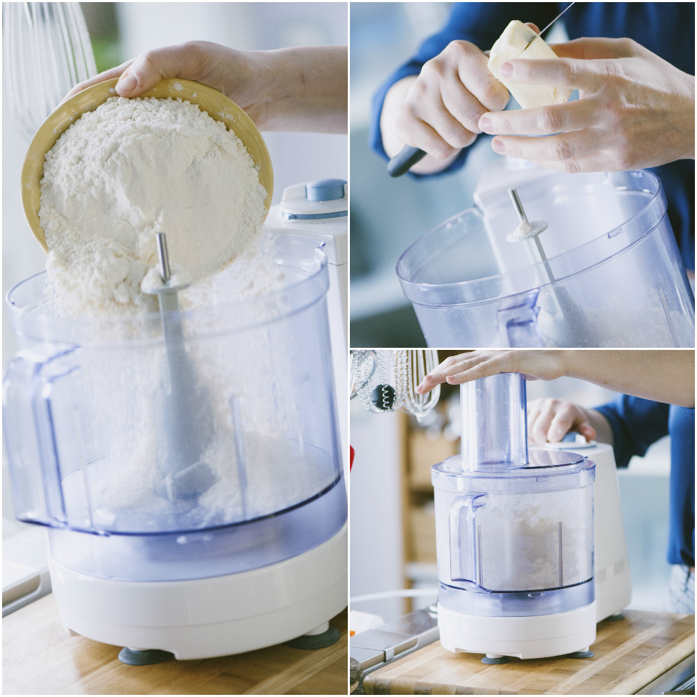 Farina versata nel food processor e burro tagliato a pezzi per la pasta brisée