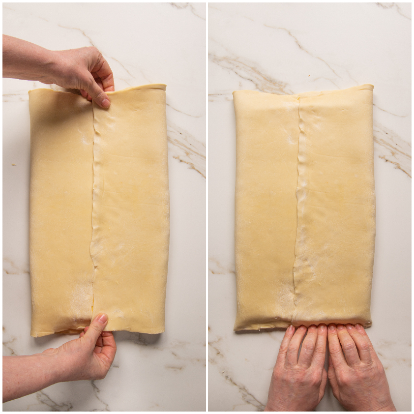 Mani che sigillano i bordi di un rettangolo di pasta sfoglia ripiegata sul panetto di burro