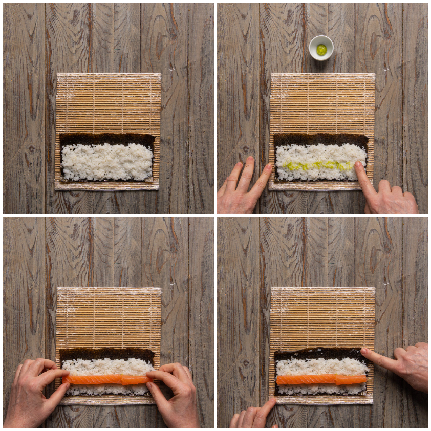 Riso steso sul nori, wasabi spalmato con le dita e striscia di salmone posizionata al centro