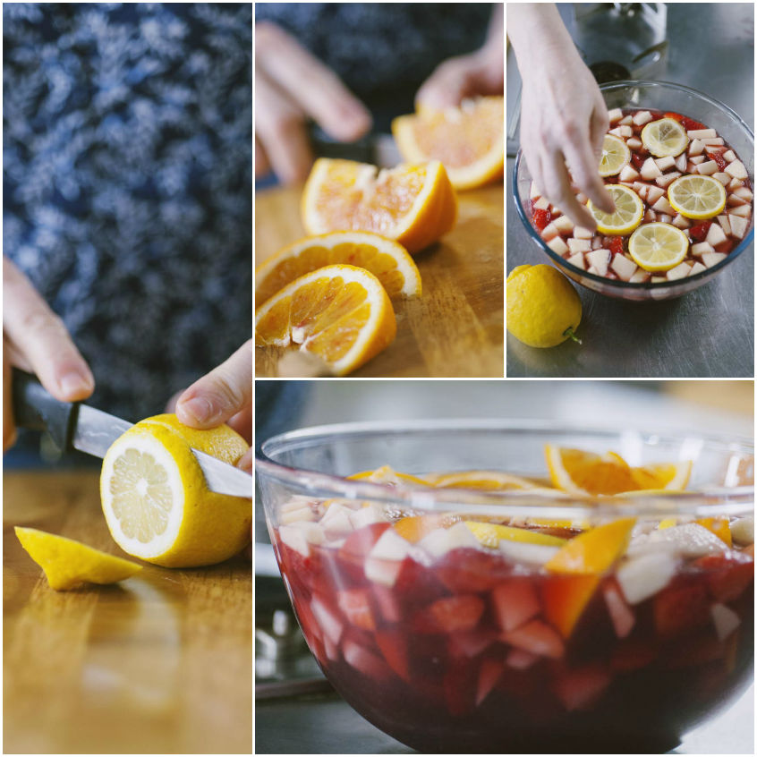 Limone tagliato a rondelle e arancia a spicchi, poi aggiunti alla ciotola con fragole e mele per la sangria