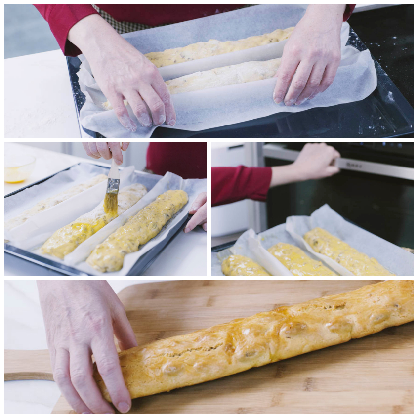 Filoncini di cantucci spennellati d'uovo e infornati, poi dorati e pronti sul tagliere