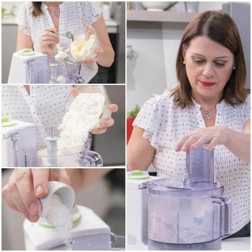 Burro a pezzetti, farina e lievito versati nel food processor per l'impasto dei biscotti