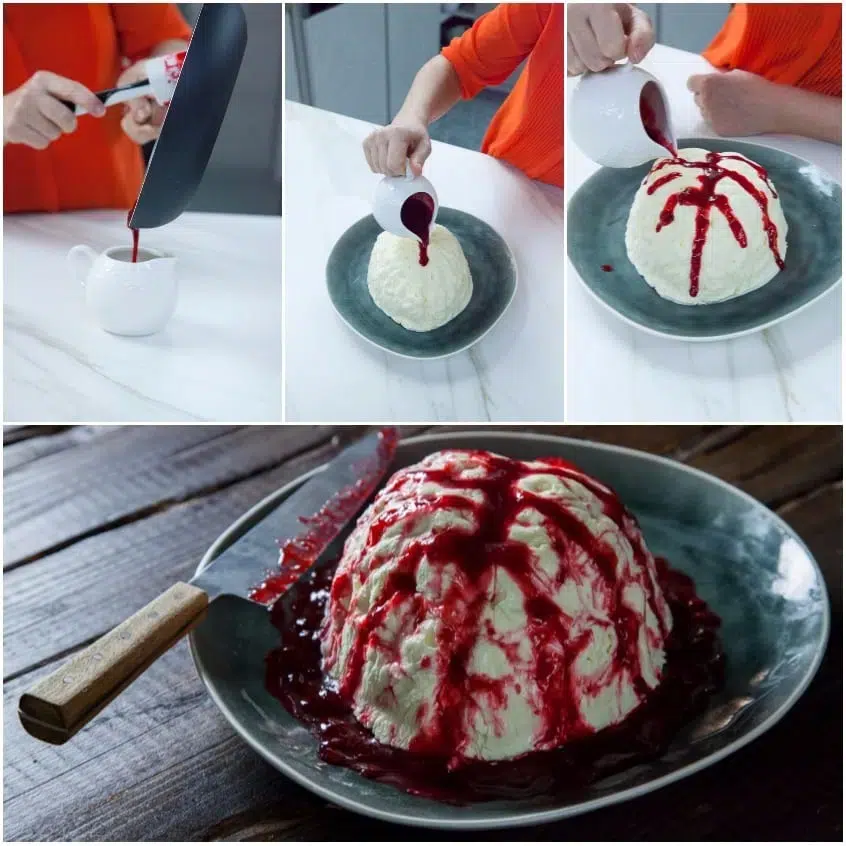 Coulis di lamponi versata sulle scanalature del dolce a forma di cervello per Halloween