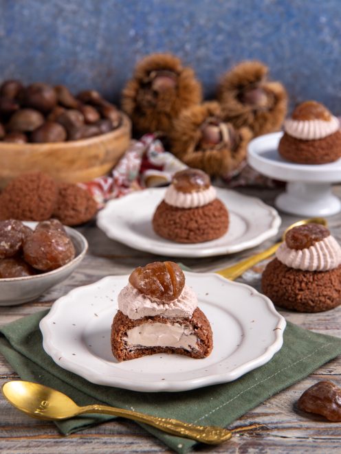 Bignè craquelin al cacao tagliato a metà con crema ai marroni e marron glacé in cima
