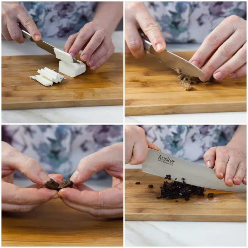 Formaggio feta tagliato a cubetti e olive nere tritate grossolanamente su tagliere di legno